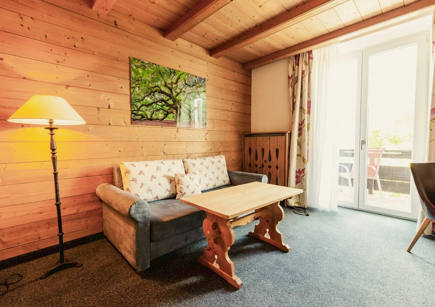 Double bed in a cosy room at a lakeside hotel