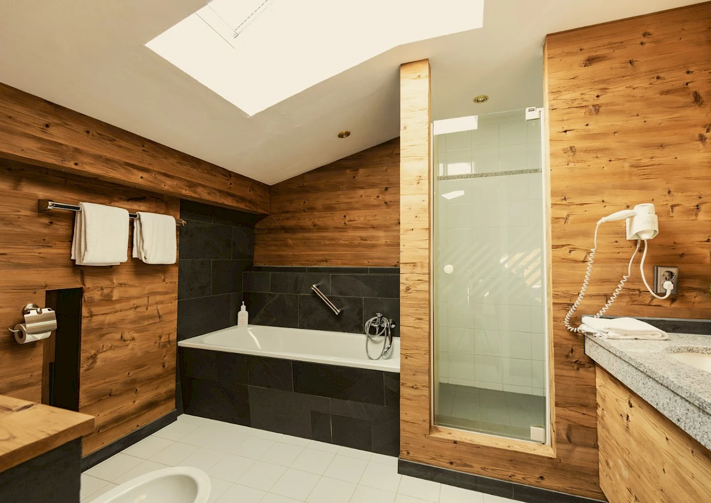 Double bed in a cosy room at a lakeside hotel