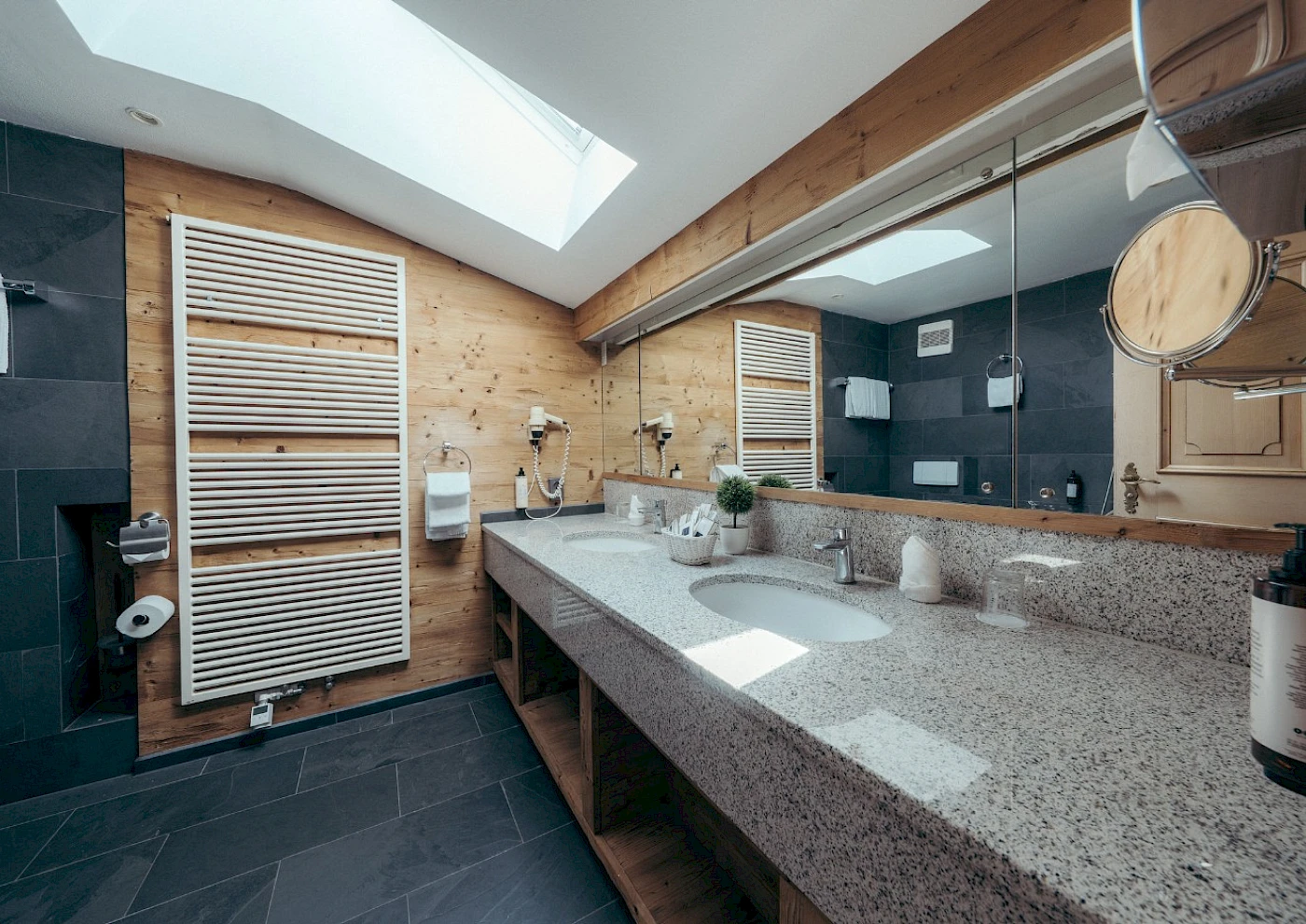 Double bed in a cosy room at a lakeside hotel